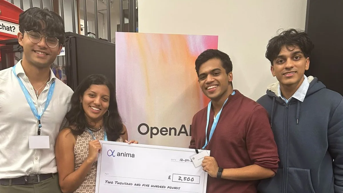 The four-person NHS-Onboard team holding an oversized Anima cheque for £2,500 marked Third Place, from the Emmanuel College announcement